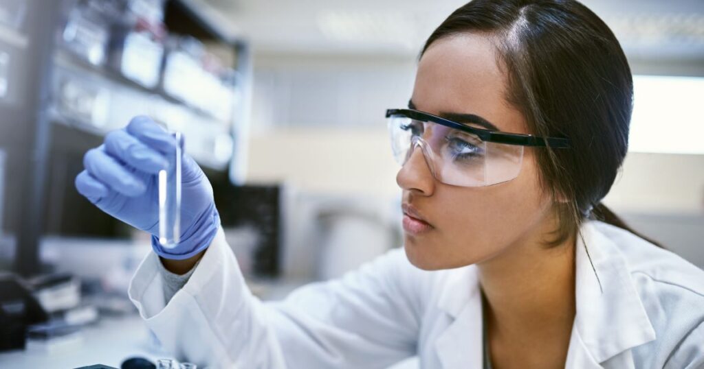 Photo of a female scientist wearing goggles