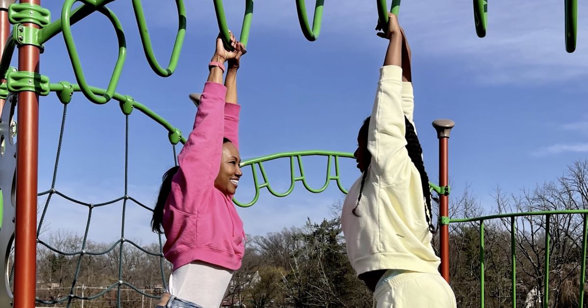 Photo of two people on a playground