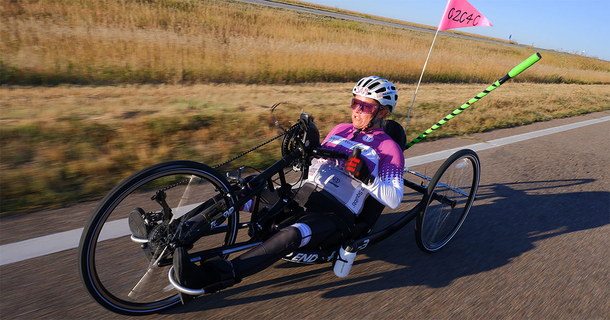 Photo of Samantha riding her handcycle bicycle