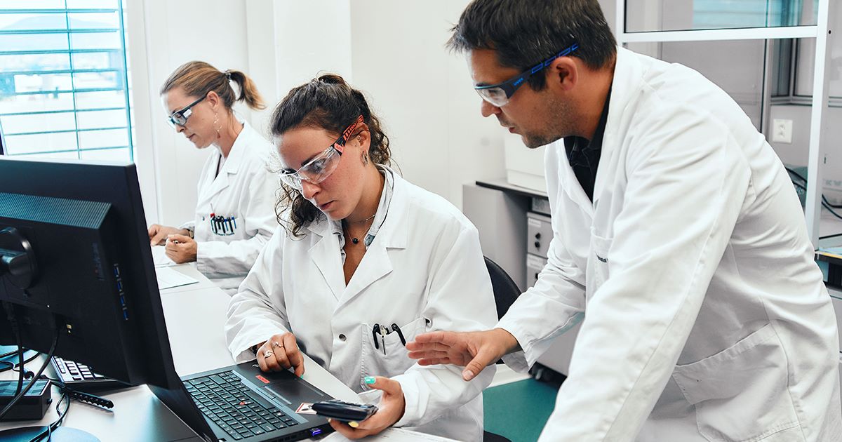 BMS employees working in a lab in Boudry, Switzerland.