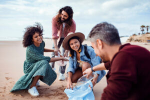 Friends cleaning the beach on vacation